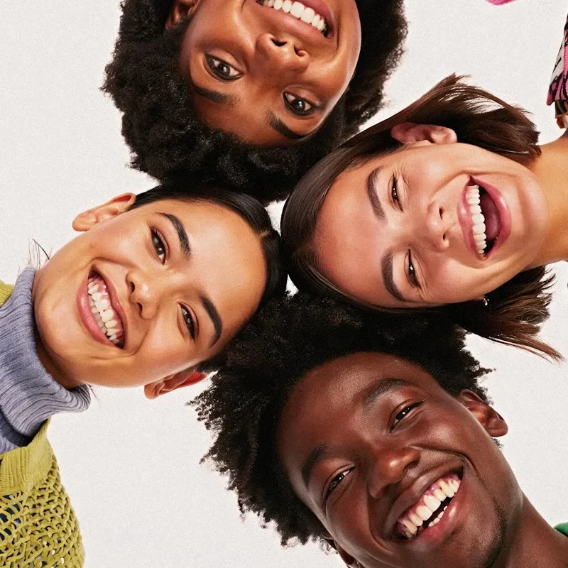 6855086ce5de8c52a2c286f0_Diverse Group Smiling